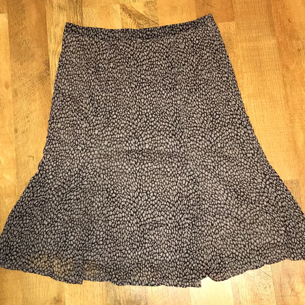 A long brown and black JH Collectibles skirt.